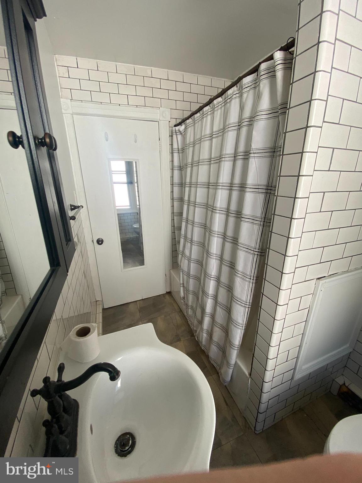 3700 Midvale Avenue, Unit 2 Philadelphia, PA 19129 - Photo 10 of 13 a bathroom with a sink and a mirror
