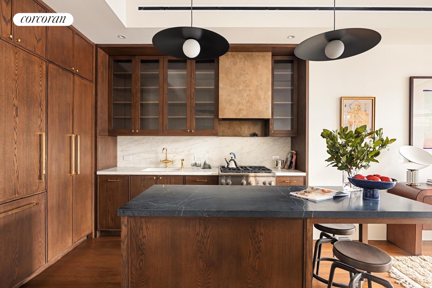 127 Kent Avenue, Unit 2C Brooklyn, NY 11249 - Photo 4 of 22 a kitchen with a table and chairs in it