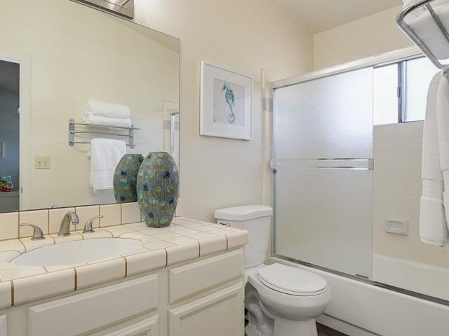 121 Redding Road, Unit B Campbell, CA 95008 - Photo 14 of 15 a bathroom with a granite countertop sink toilet and shower