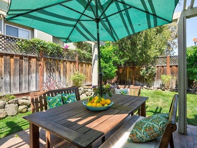 121 Redding Road, Unit B Campbell, CA 95008 - Photo 2 of 15 a view of a patio with table and chairs under an umbrella