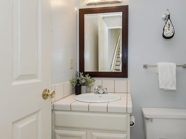 121 Redding Road, Unit B Campbell, CA 95008 - Photo 10 of 15 a bathroom with a toilet sink and mirror