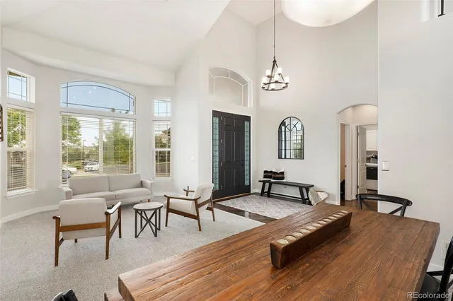 a living room with furniture rug and window
