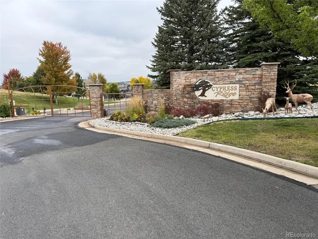 a view of a house with a yard and lake view
