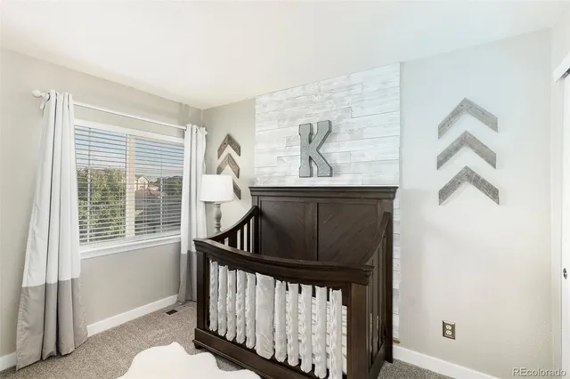 a view of entryway with a window and wooden floor