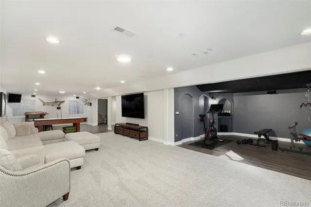 a view of a livingroom with furniture and a flat screen tv