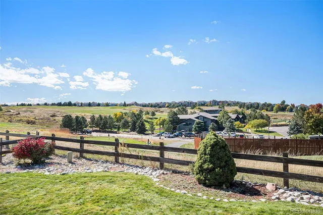 an aerial view of a house with swimming pool patio and outdoor seating