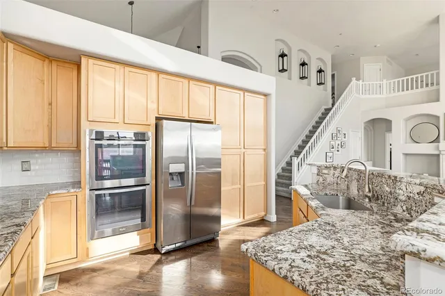 a view of a kitchen with furniture and entryway
