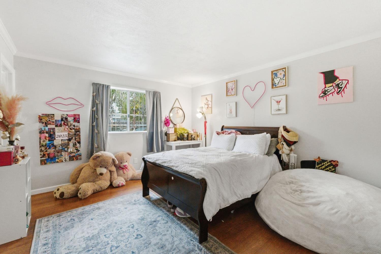 204 West Cesar Chavez Boulevard Fresno, CA 93706 - Photo 17 of 28 a bedroom with bed and a couch