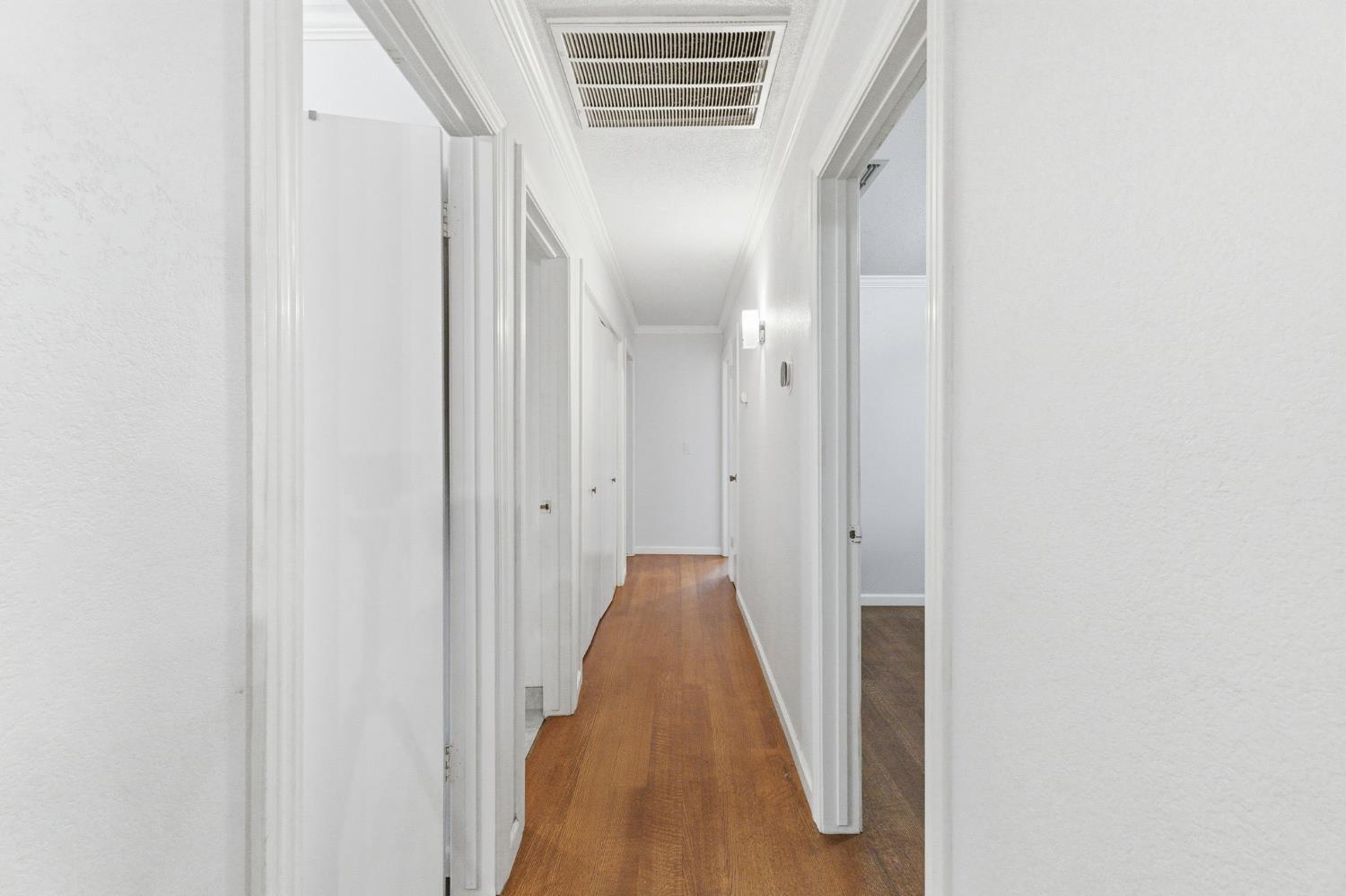 204 West Cesar Chavez Boulevard Fresno, CA 93706 - Photo 22 of 28 a view of a hallway with a white door