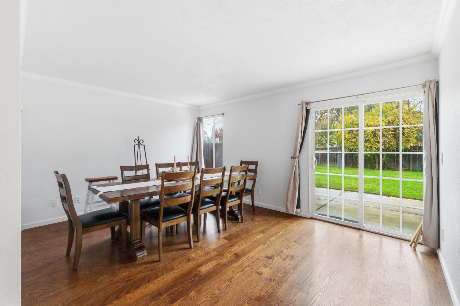 204 West Cesar Chavez Boulevard Fresno, CA 93706 - Photo 23 of 28 a view of a dining room with furniture and wooden floor