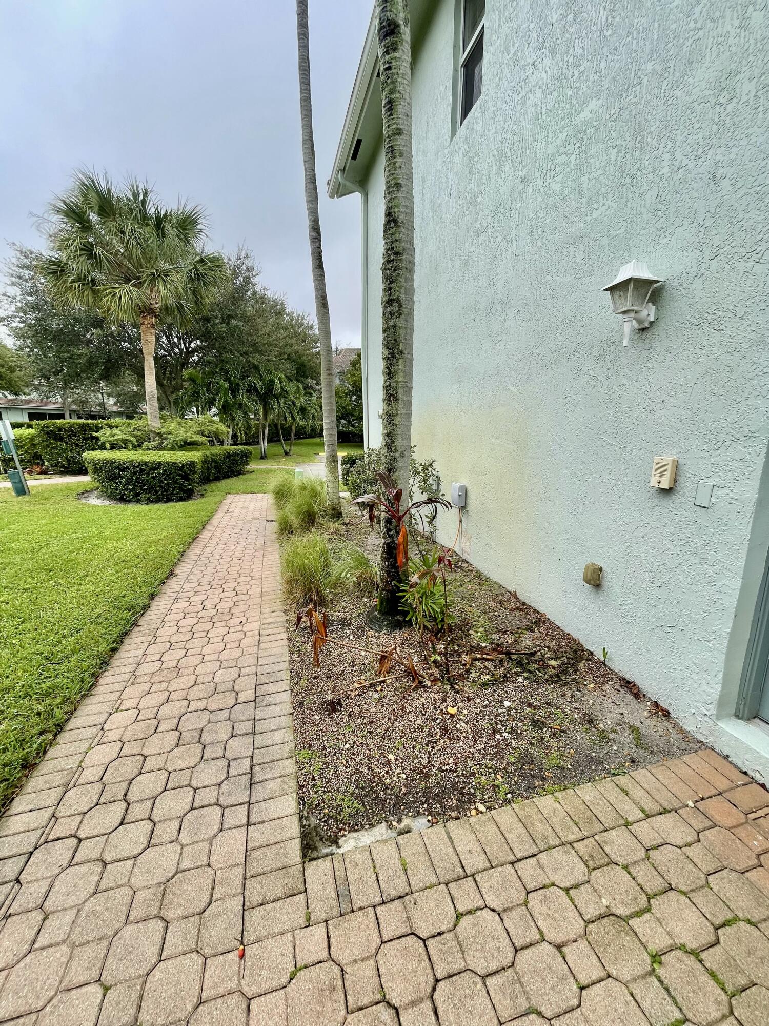 3043 Laurel Ridge Circle Riviera Beach, FL 33404 - Photo 3 of 35 PATH TO THE FRONT DOOR