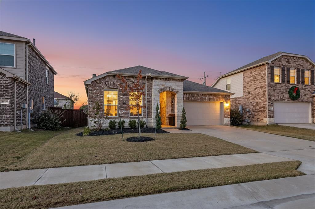 1810 Hummingbird Street Princeton, TX 75407 - Photo 3 of 25 Everything in this home is exceptional From the curb appeal, to the grand entrance, to the epoxied garage floor.
