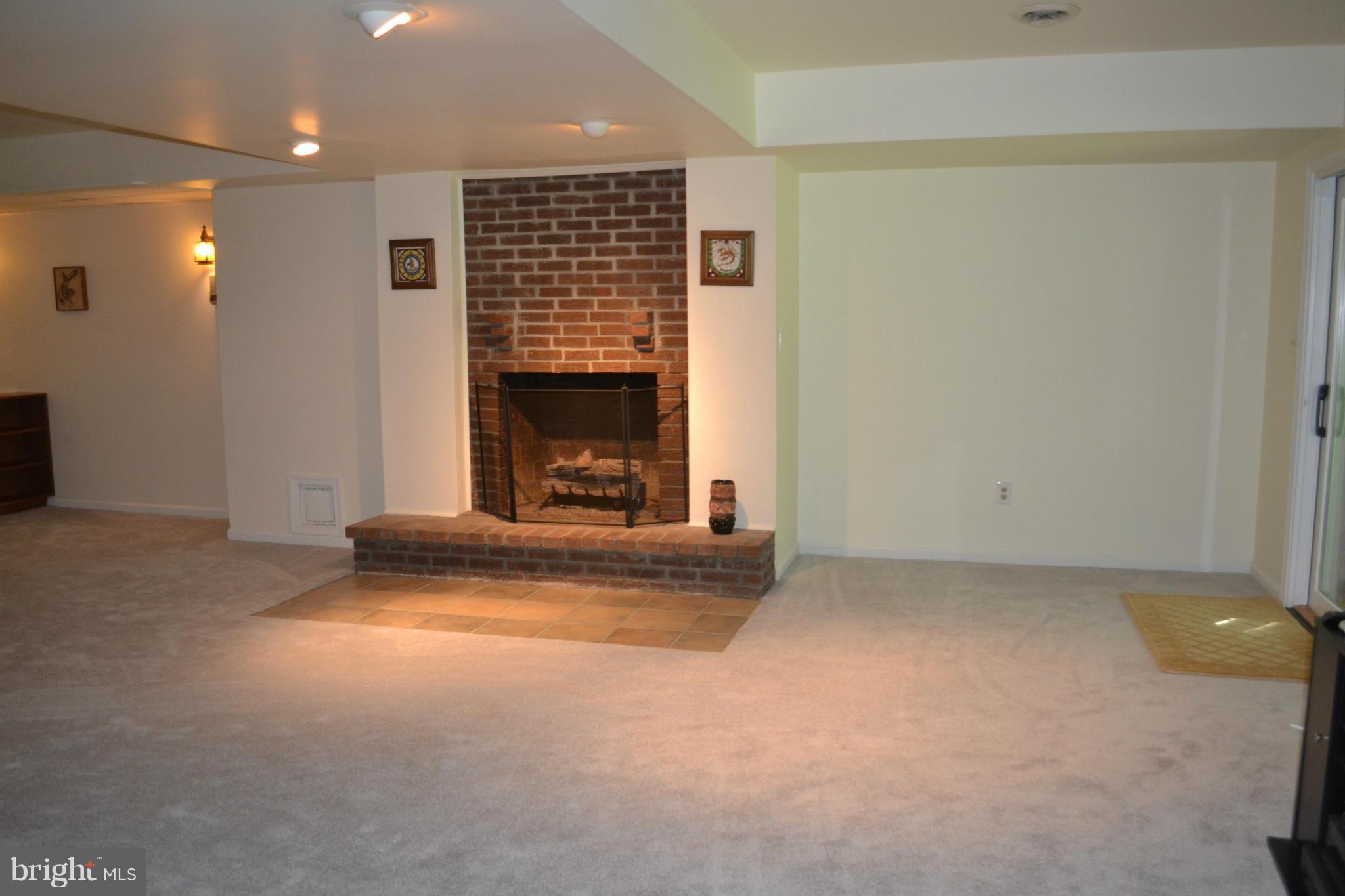 1560 Lottie Fowler Road Prince Frederick, MD 20678 - Photo 26 of 27 Basement rec room with wet bar