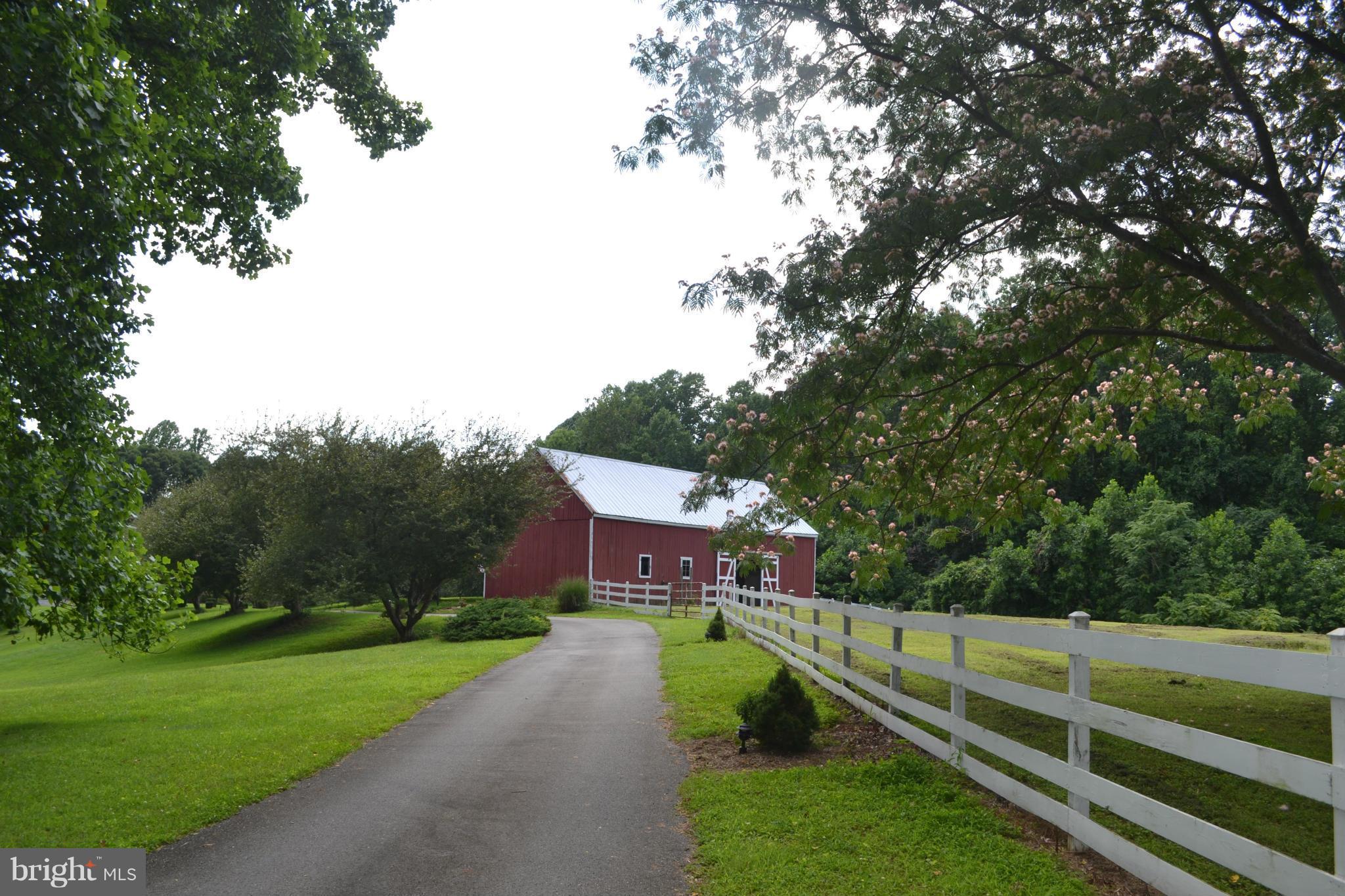Driveway past barn to home