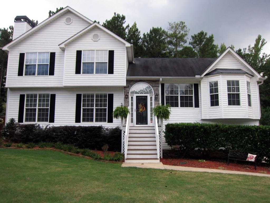445 Spring Meadows Avenue Dallas, GA 30157 - Photo 1 of 1 This beautiful tri-level home has lots of space. Vinyl siding with stone accents.
