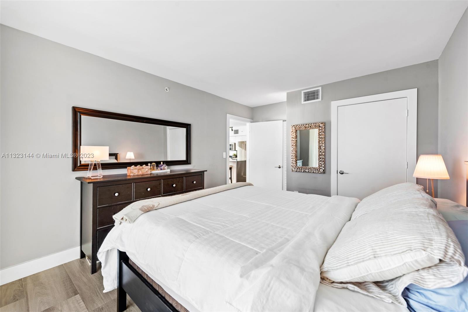 90 Alton Road, Unit 1602 Miami Beach, FL 33139 - Photo 20 of 34 a bedroom with a bed and a flat screen tv