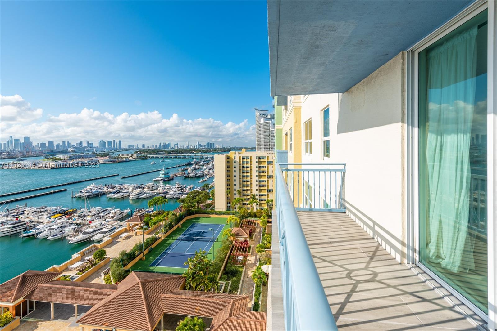 90 Alton Road, Unit 1602 Miami Beach, FL 33139 - Photo 8 of 34 a view of a balcony with wooden floor