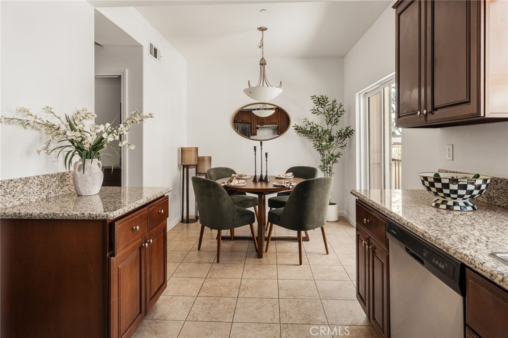 4612 Peck Road, Unit D El Monte, CA 91732 - Photo 16 of 57 a kitchen with granite countertop sink table and chairs