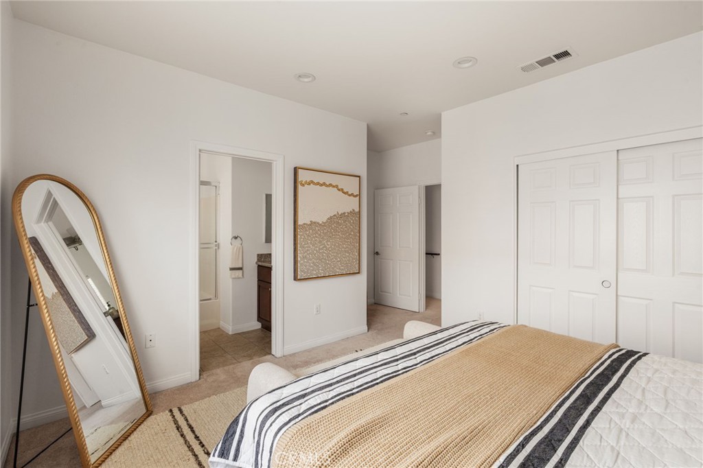 4612 Peck Road, Unit D El Monte, CA 91732 - Photo 21 of 57 a bedroom with a bed and a mirror
