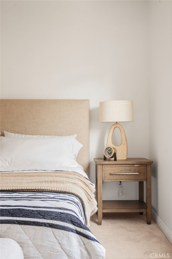 4612 Peck Road, Unit D El Monte, CA 91732 - Photo 23 of 57 a bedroom with a bed and lamp