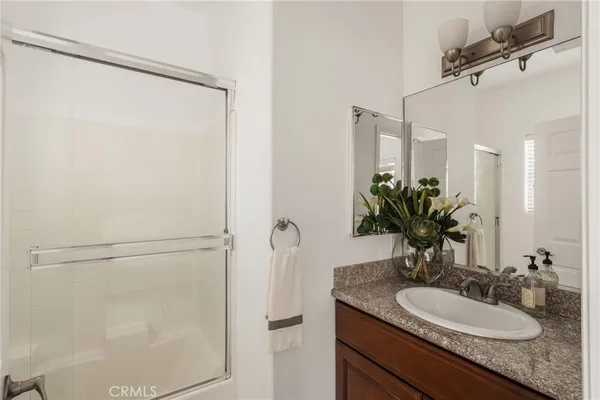 a bathroom with a toilet a sink and shower