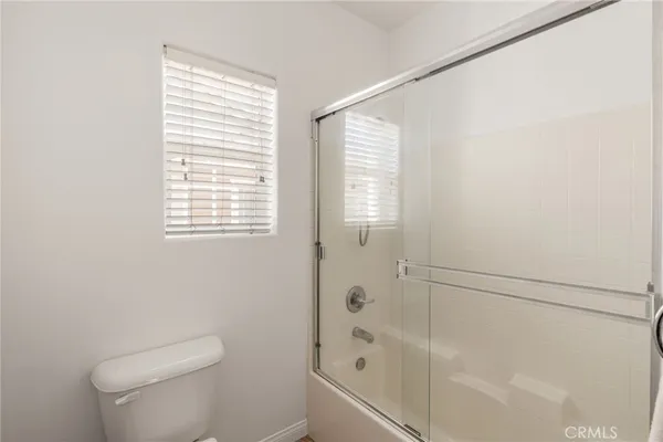 a bedroom with a bed and closet