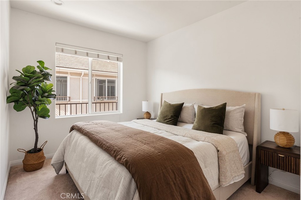 4612 Peck Road, Unit D El Monte, CA 91732 - Photo 27 of 57 a bedroom with a bed and a potted plant