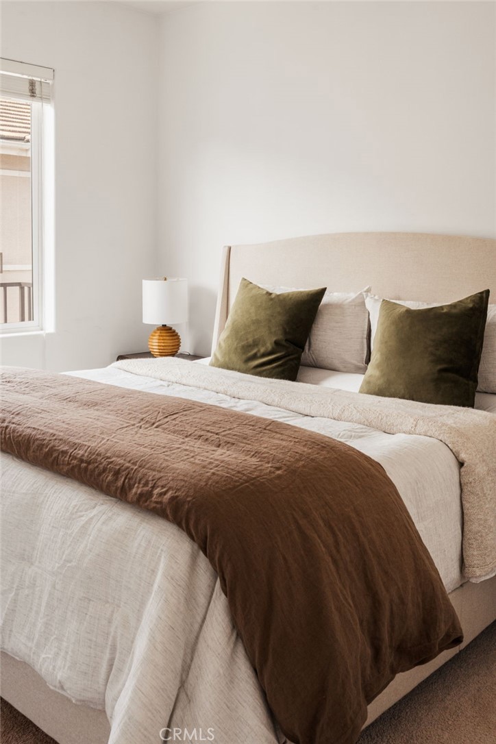 4612 Peck Road, Unit D El Monte, CA 91732 - Photo 28 of 57 a bedroom with a bed and window