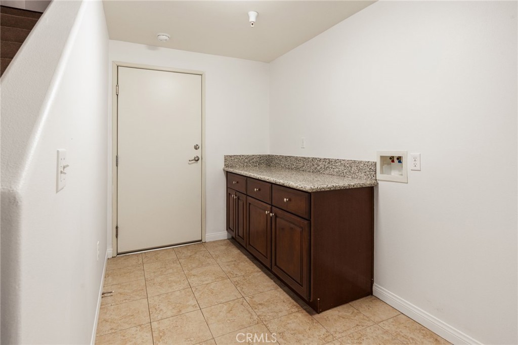 4612 Peck Road, Unit D El Monte, CA 91732 - Photo 33 of 57 a kitchen with a stove top oven and cabinets