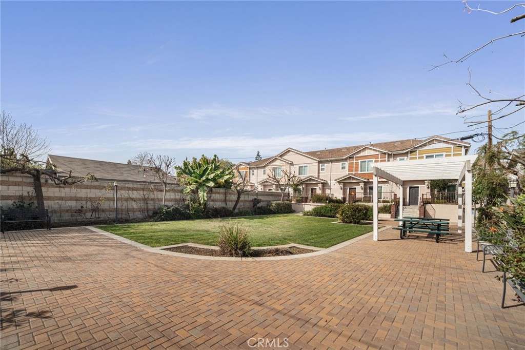 4612 Peck Road, Unit D El Monte, CA 91732 - Photo 38 of 57 a view of a house with a yard