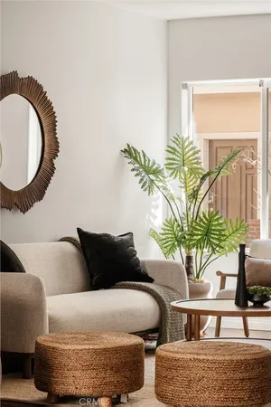 a living room with furniture and a lamp