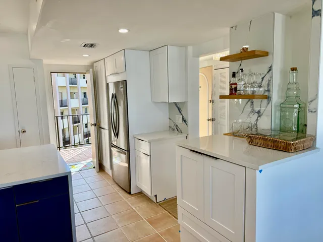 a bathroom with a double vanity sink mirror and bathtub