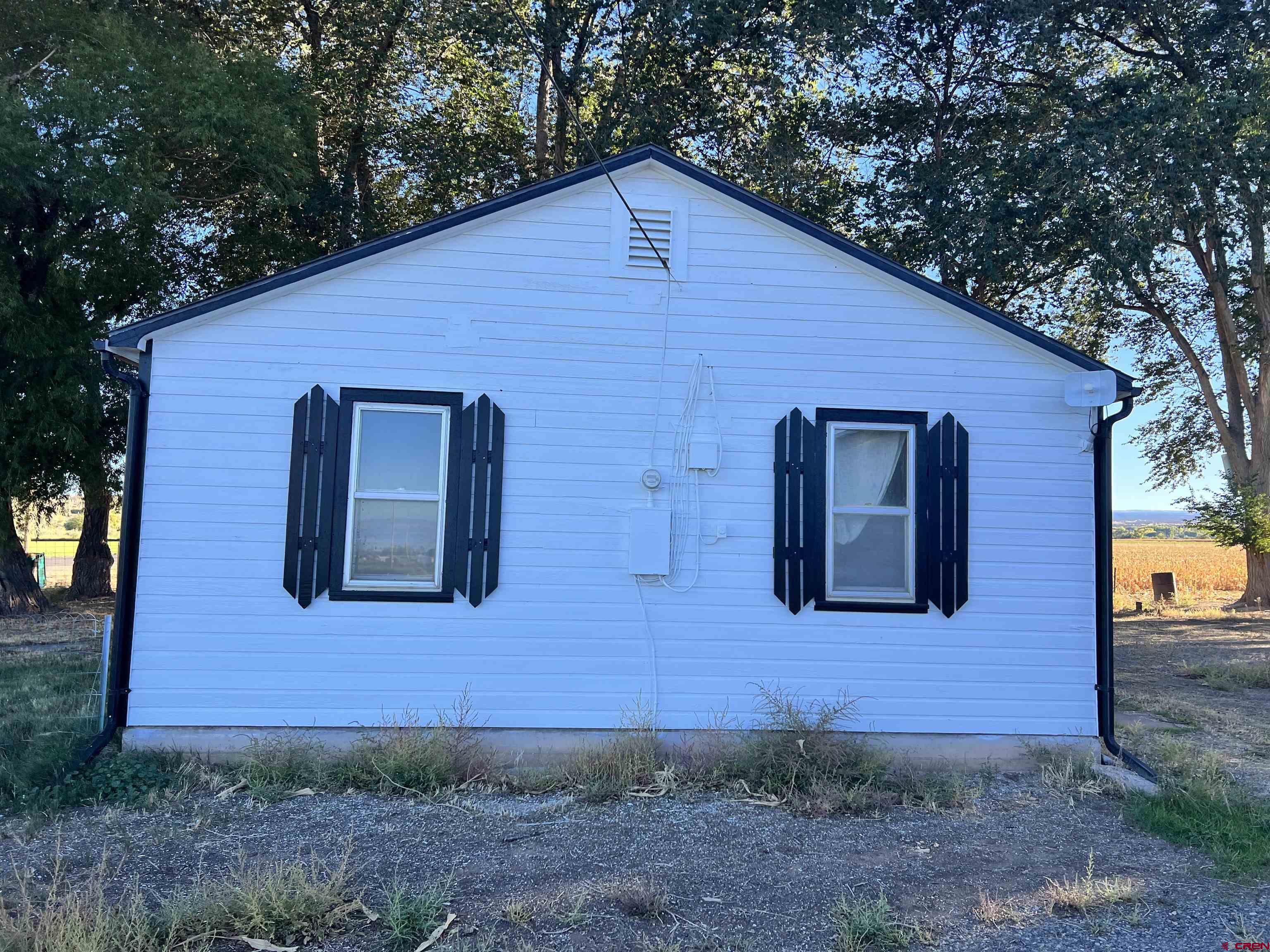 8139 5600th Road Olathe, CO 81425 - Photo 11 of 30 a front view of a house with garden