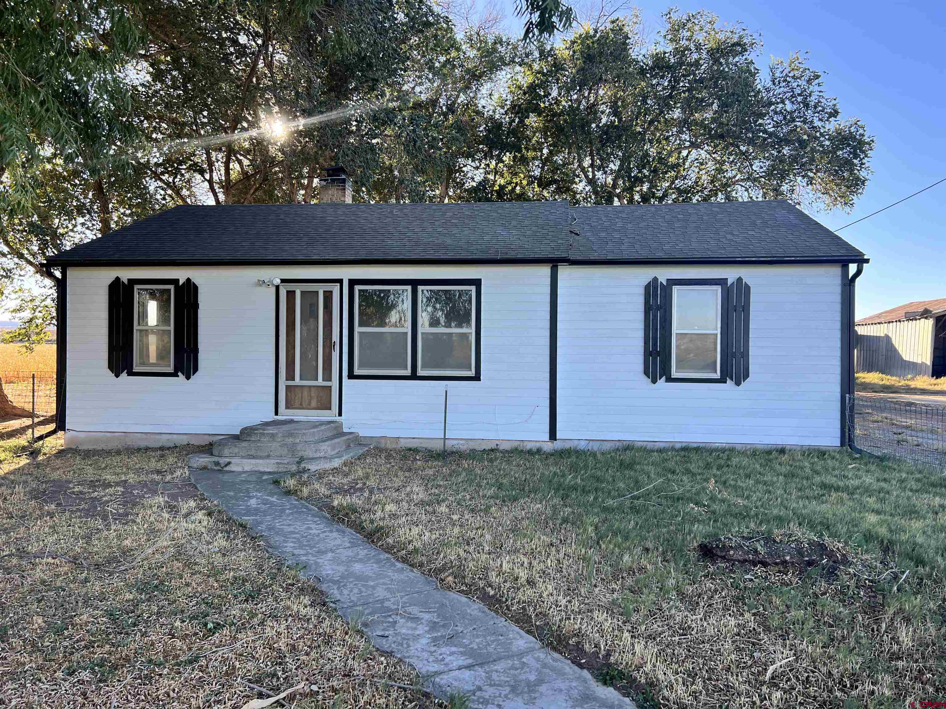 8139 5600th Road Olathe, CO 81425 - Photo 8 of 30 a view of a house with a yard