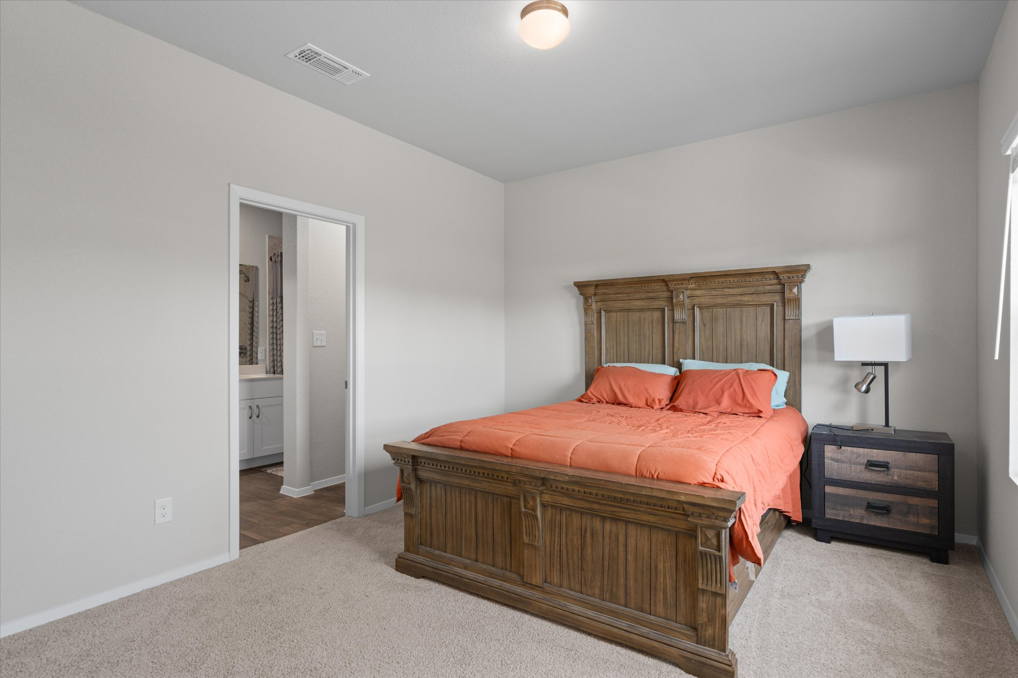 2606 Totley Road Manor, TX 78653 - Photo 15 of 28 a bedroom with a bed and a closet
