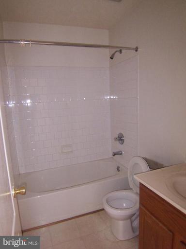 10102 Summershade Lane Springdale, MD 20721 - Photo 11 of 12 a bathroom with a shower and a toilet