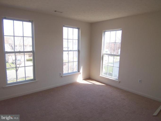 10102 Summershade Lane Springdale, MD 20721 - Photo 12 of 12 an empty room with a window