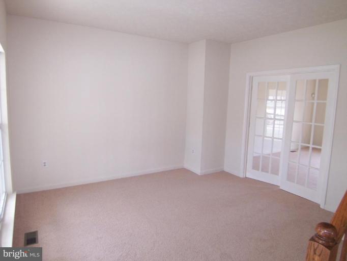 10102 Summershade Lane Springdale, MD 20721 - Photo 3 of 12 a view of an empty room with a window