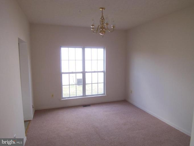 10102 Summershade Lane Springdale, MD 20721 - Photo 4 of 12 an empty room with a window