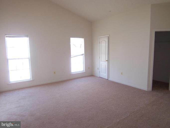 10102 Summershade Lane Springdale, MD 20721 - Photo 9 of 12 an empty room with windows