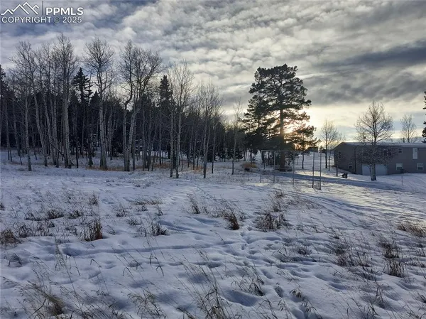 a view of wooden fence of a house