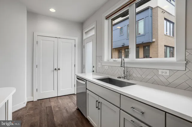 a kitchen with a sink and cabinets