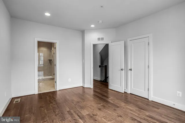 a bathroom with a double vanity sink mirror and shower