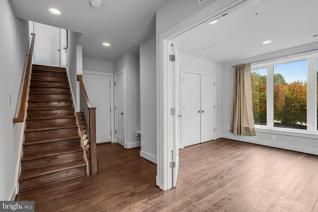 a view of entryway with wooden floor