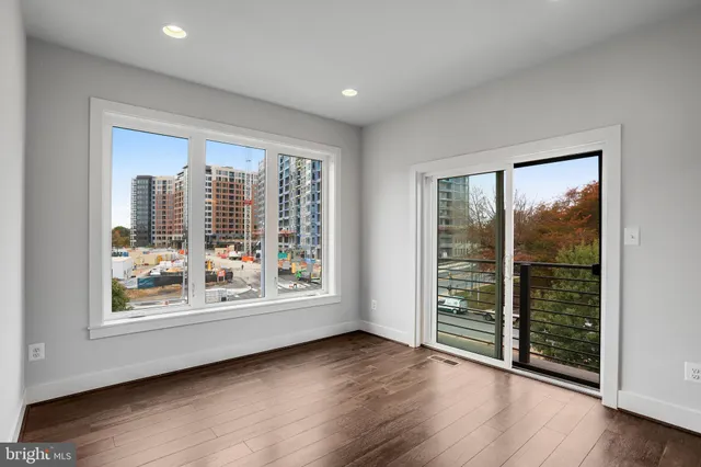 wooden floor in an empty room with a gallery