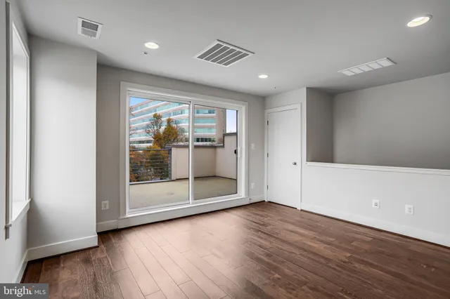 a bathroom with a sink toilet vanity and tub