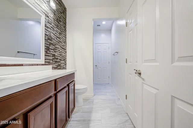 a view of room with a ceiling fan and window