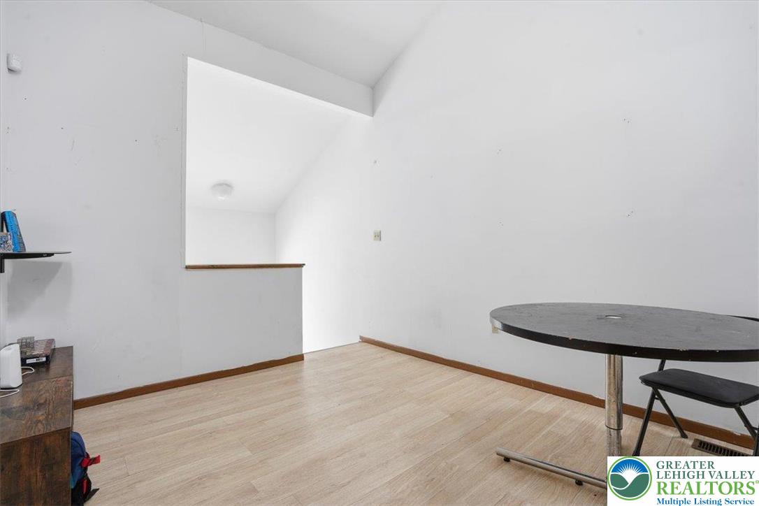 3301 Windermere Drive Bushkill, PA 18324 - Photo 26 of 71 a view of a room with wooden floor and a window