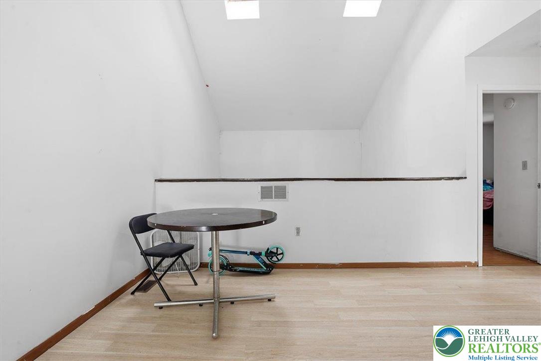 3301 Windermere Drive Bushkill, PA 18324 - Photo 28 of 71 a view of wooden floor and a table in a room