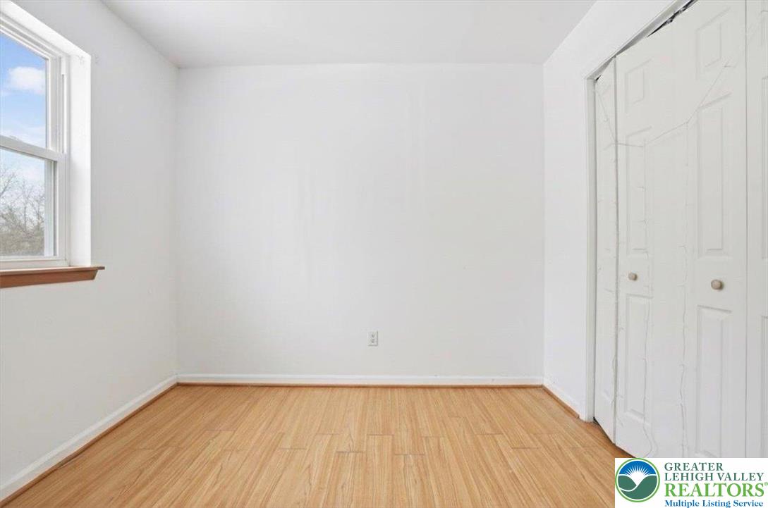 3301 Windermere Drive Bushkill, PA 18324 - Photo 33 of 71 a view of an empty room with wooden floor and a window